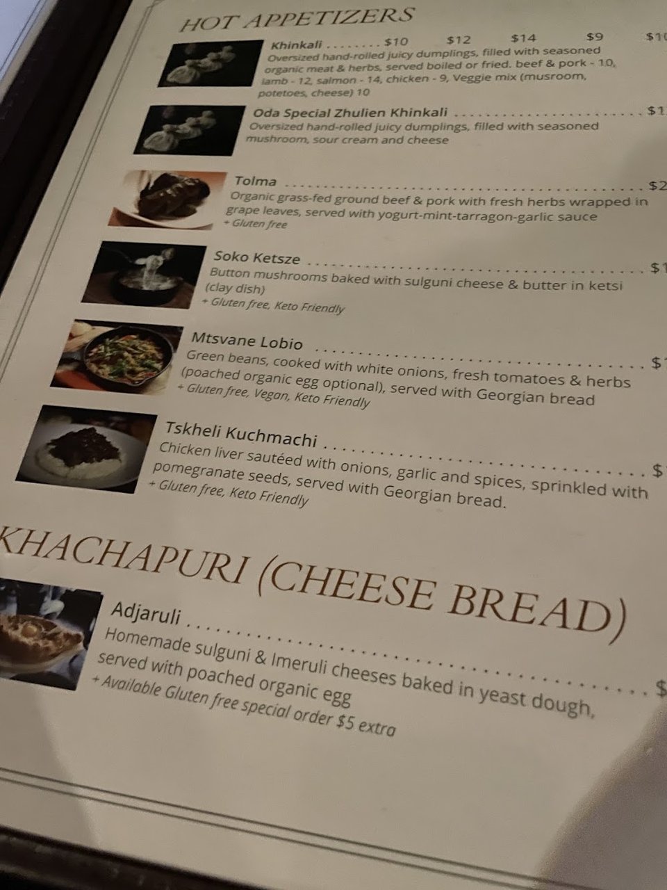 Printed menu with Georgian starters and mains.
